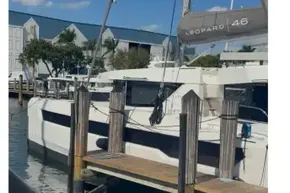Modern Leopard 46 catamaran docked at marina, 2025 model, under clear blue sky.