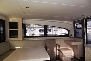Interior of 2017 Leopard 43 Powercat yacht with dining area and large windows.