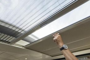 Hand adjusting sunroof on 2025 Linssen 45 SL Sedan yacht.