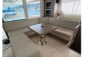 Luxurious interior of 2021 Leopard 50 yacht with elegant seating and panoramic windows.