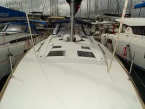 2017 Beneteau Oceanis 45 sailboat docked in a marina, showcasing sleek deck design.