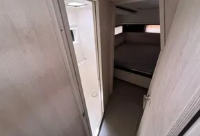 Interior of 2019 Leopard 45 yacht showing a bedroom and bathroom.