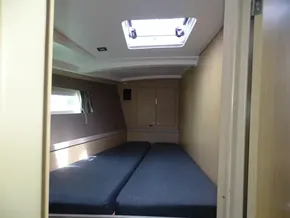 Cabin interior of 2017 Beneteau Oceanis 45 sailboat with twin beds and skylight.