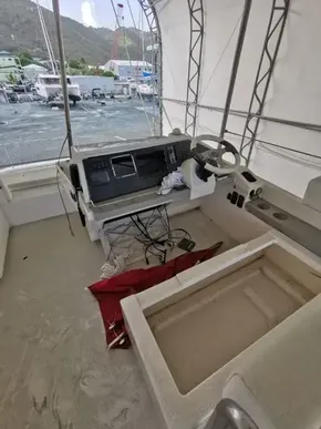 2017 Leopard 43 Powercat helm station under cover, with visible controls and wiring.
