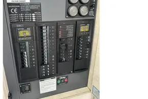 Electrical panel of a 2021 Leopard 50 yacht, featuring circuit breakers and gauges.
