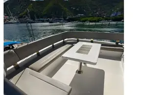 Leopard 50 yacht deck with seating and table, 2021 model, scenic water view.