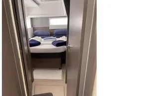 Interior cabin of a 2022 Leopard 45 yacht with a neatly made bed.