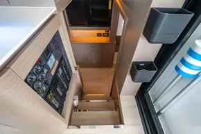 Interior of 2025 Leopard 46 yacht, featuring modern stairs and control panel.