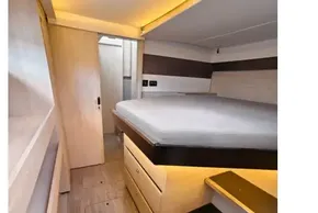 Modern interior of 2020 Leopard 50 yacht cabin with bed and storage.