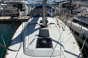 2020 Jeanneau Sun Odyssey 389 sailboat docked at marina, featuring sleek deck design.