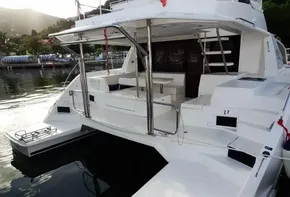 2018 Leopard 43 Powercat docked, rear view showing spacious deck and seating area.
