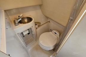 1999 Wellcraft 2400 Martinique boat bathroom with sink and toilet.