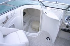 Crownline Deck Boat 220 EX - A convenient head enclosure holds a portable toilet complete with a light, sink and shower