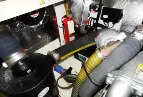 Engine compartment of a 2020 Leopard 43 Powercat with fire extinguisher and various hoses.