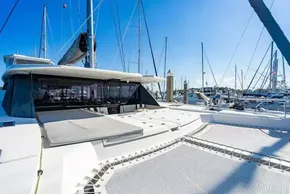 2022 Leopard 50 catamaran docked at marina, featuring spacious deck and modern design.