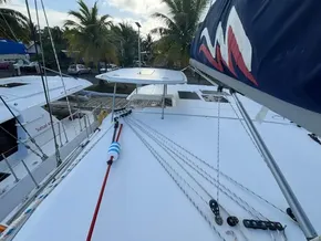 2019 Leopard 40 catamaran deck with rigging, docked near palm trees.