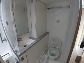 Modern bathroom in a 2019 Leopard 45 yacht, featuring a toilet and sink.