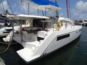 2021 Leopard 40 catamaran docked at marina under clear blue sky.
