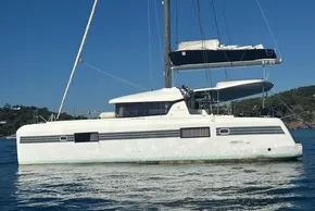 2017 Lagoon 42 catamaran sailing on calm blue waters.