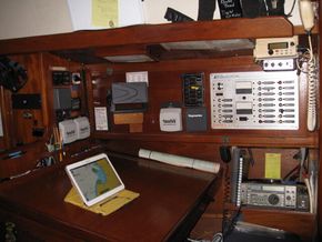 The Navigation Station and Electrical Panel are located starboard of the engine.  A Freezer is located beneath the Chart Table.