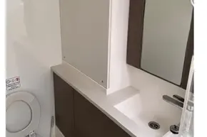 Modern bathroom in 2022 Leopard 45 yacht, featuring sleek design and fixtures.