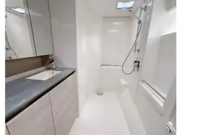 Modern bathroom in 2020 Leopard 50 yacht with sleek fixtures and spacious shower.