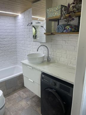 Bathroom with a Washer-Dryer for Full Onboard Convenience.