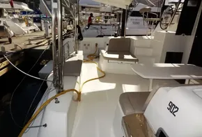 2020 Lagoon 42 catamaran interior with seating and table at marina.
