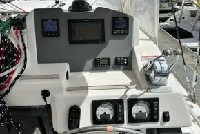Control panel of a 2021 Leopard 50 yacht with navigation instruments and throttle levers.