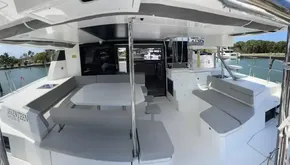 Leopard 50 catamaran 2020 model, spacious outdoor seating and dining area with modern design.