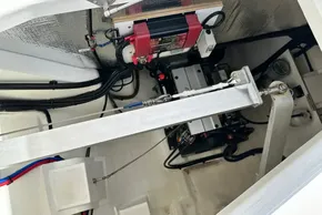 Engine compartment of a 2021 Leopard 50 yacht, showcasing mechanical components and wiring.