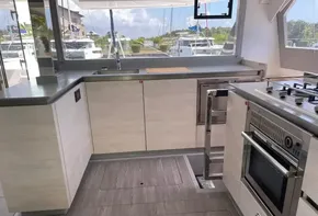 Modern kitchen on a 2020 Leopard 50 yacht with sleek cabinetry and stainless steel appliances.