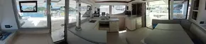 Interior of 2019 Leopard 45 catamaran, featuring modern kitchen and spacious seating area.