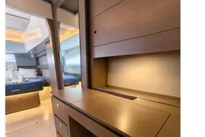 Luxurious interior of 2021 Leopard 50 yacht with modern wood finish and elegant lighting.