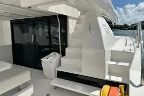 2025 Robertson and Caine Leopard 46 Powercat yacht deck with stairs and glass doors.