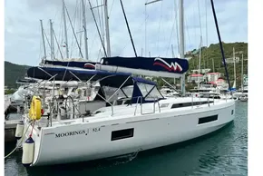 2023 Beneteau Oceanis 51.1 yacht docked in marina, featuring sleek design and modern sails.