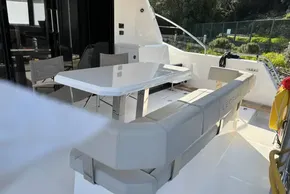 2024 Leopard 40 Powercat yacht with sleek outdoor seating and dining area.
