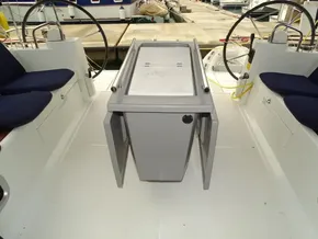 2017 Beneteau Oceanis 45 cockpit with dual steering wheels and central folding table.