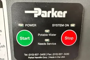 Control panel for Parker potable water system, featuring start and stop buttons.