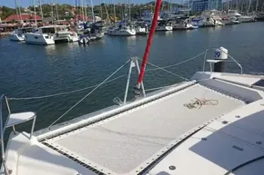 Leopard 45 catamaran docked at marina, showcasing netted deck area, 2022 model.
