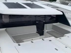 Leopard 45 catamaran, 2021 model, featuring solar panels and spacious seating area.