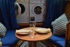 Dining area with washing machine and tumble dryer 