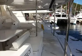 2015 Leopard 51 Powercat yacht docked at marina, featuring spacious deck and seating area.