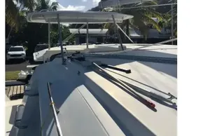2020 Leopard 40 catamaran deck with palm trees and clear sky background.