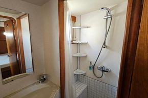 Bathroom interior of 2008 Linssen Grand Sturdy 380 AC yacht, featuring shower and sink.
