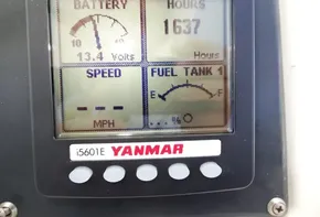 Yanmar engine display on a 2017 Leopard 43 Powercat showing battery, hours, speed, and fuel tank levels.