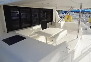 2017 Leopard 43 Powercat yacht with spacious outdoor seating area and dining table.