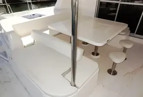 Leopard 51 Powercat 2015 boat interior with white seating and dining area.