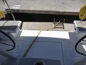 Beneteau Oceanis 46.1 yacht stern view, docked, with dual steering wheels, 2020 model.
