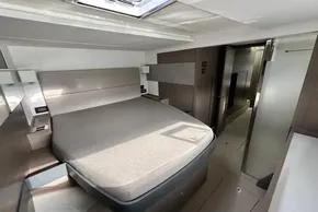 Luxurious interior cabin of 2022 Leopard 53 Powercat yacht, featuring a comfortable bed.